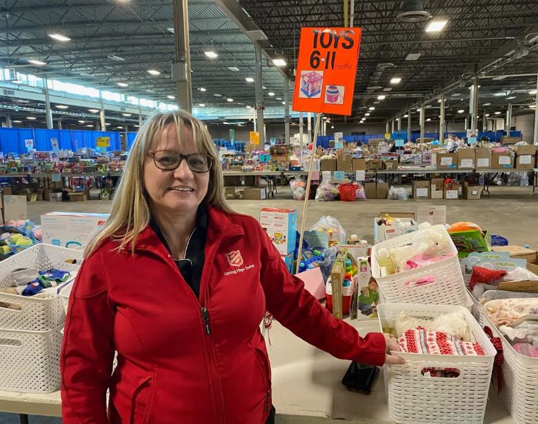 Nancy standing in front of toy sorting area.